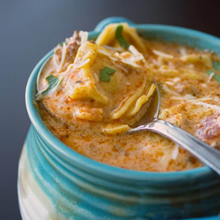 Slow Cooker Creamy Tomato Tortellini Soup from dishesanddustbunnies.com